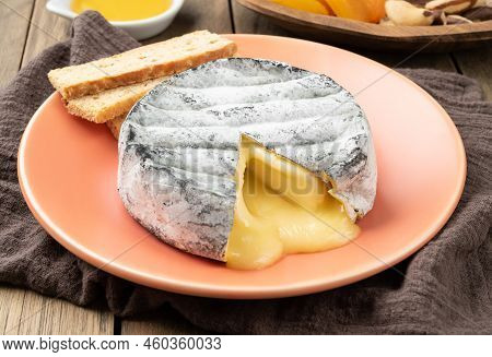 Meçted Brazilian Artisan Lua Cheia Cheese With Toasts, Fruits And Nuts Over Wooden Table.