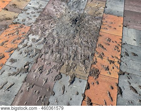 Traces On The Pavement Tile From The Explosion Of A Mortar Shell. War, Racism