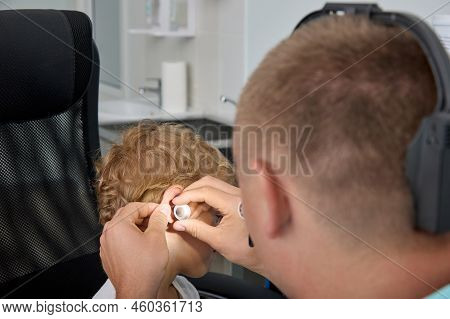 View From Above Examination By Otolaryngologist Of Eardrum Of The Childs Ear With The Help Of The Ea