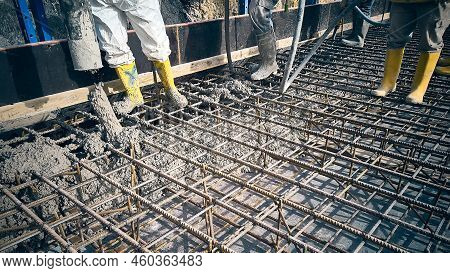 Contractor Is Casting Concrete Using Concrete Pump Tube. Cement Works On A Construction Site. Constr