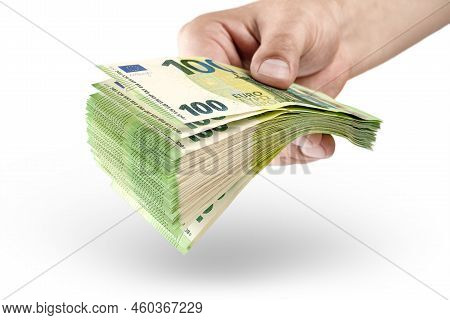Stack Of Money In Hand Isolated On White Background. 100 Euro Banknotes In A Mans Hand. A Man Holds 