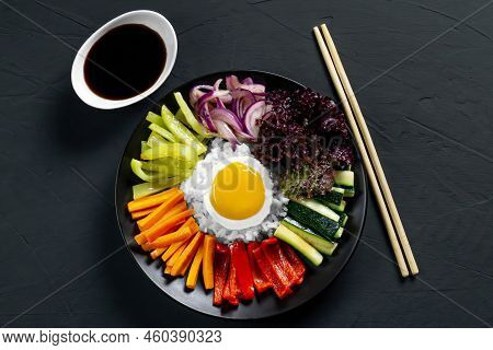 Close-up Of A Korean Dish, With A Variety Of Appetizers With Vegetables And Eggs. Diet. Bibimbap. To
