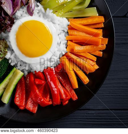 Close-up Of A Korean Dish, With A Variety Of Appetizers With Vegetables And Eggs. Diet. Bibimbap. To