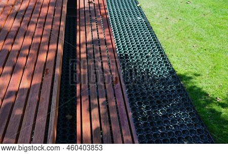 Installation Of A Plastic Mat As A Substitute For Lawn. Plastic Permeable Tiles Are Filled With A Fi