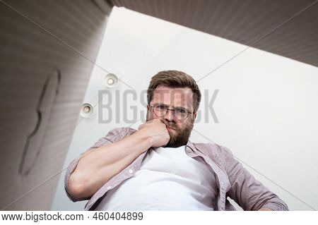 Thoughtful Man Unpacked The Delivered Box With A Parcel, He Is At A Loss, He Was Not Brought What He