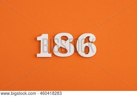 White Wooden Number 186 On Eva Rubber Orange Background