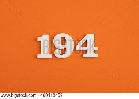 White Wooden Number 194 On Eva Rubber Orange Background
