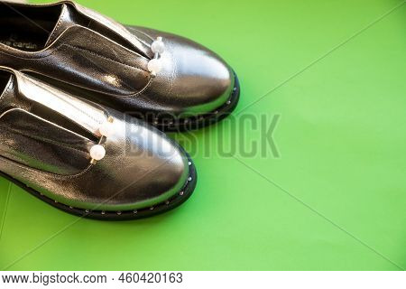 Studio Shot Of Silver Autumn Boots, Isolated On Green Background.fashionable Trendy Leather Womens H