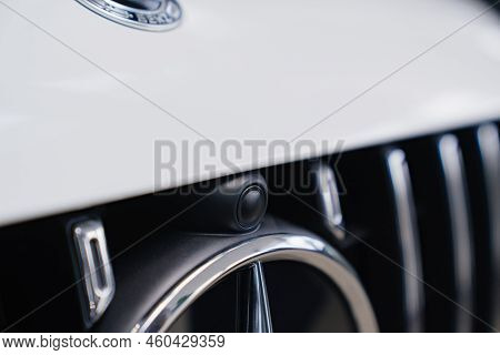Logo And Camera Parktronic. A White Mercedes-benz Car.
