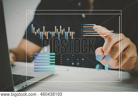 Man Hand Using Laptop To Working Technology.hand Toucing Virtual Screen Graph And Chart Data Analysi