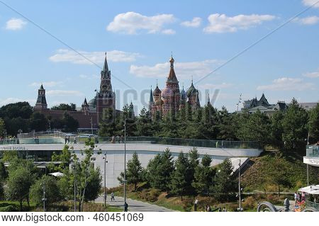Сolourful Domes Roofs Of St. Basil's Cathedral, Kremlin Towers And Green Trees Of Zaryadye Park At S