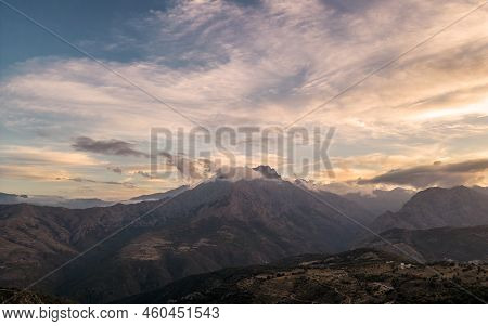 Dusk Falling On The 2389 Metre Peak Of Monte Padro And Surrounding Mountains In The Balagne Region O
