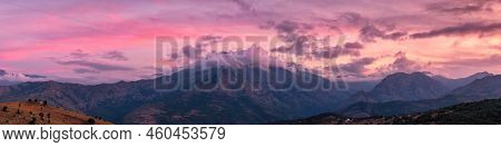 Panoramic View Of Sunset Over The 2389 Metre Peak Of Monte Padro And Surrounding Mountains In The Ba