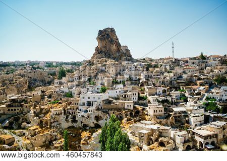 Cappadocia, Turkey - 20 July 2021. Day View Of Goreme Town With Blue Clear Sky On Horison. Famous Ce