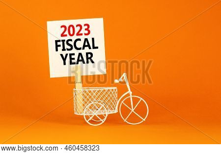 2023 Fiscal Year Symbol. White Paper With Words 2023 Fiscal Year, Clip On Wooden Clothespin. Bicycle