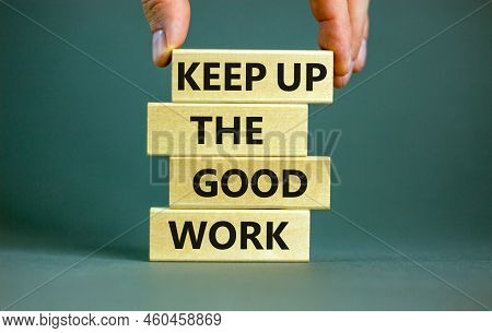 Keep Up The Good Work Symbol. Concept Words Keep Up The Good Work On Wooden Blocks. Businessman Hand