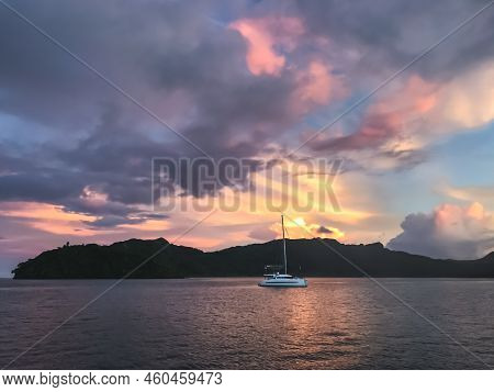 Dramatic Sunset Ocean Scene. Yacht Sail Calm Sea