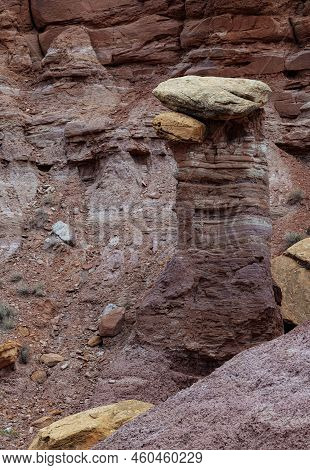 A Sandstone Spire Has A Capstone On It Created By Uneven Erosion And Wethering, Grand Staircase Esca