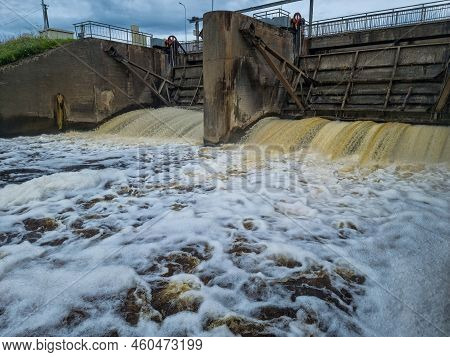 Dirty Brown Foamy Water In The River Nevezis City Panevezys Of Lithuania City Dam