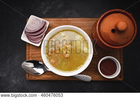 Mutton Khashlama On A Wooden Board, Spices And Onions, Top View