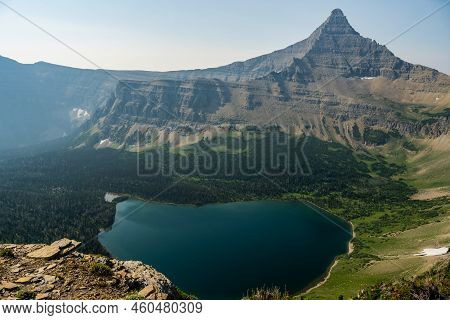 Old Man Lake Sits Below  Flinsch Peak In Glacier National Park