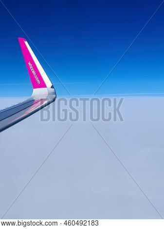 Malmo, Sweden - August 22, 2022: Left Wing Of Wizzair Airplane After Taking Off Above Malmo Sturup A