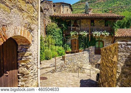 Houses Made Of Stone And Wooden Balconies In The Mountain Village Of Beget, Catalonia, Spain.