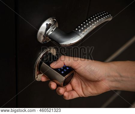 Woman Opens The Combination Lock On The Door To The Apartment. Keyless Entry.