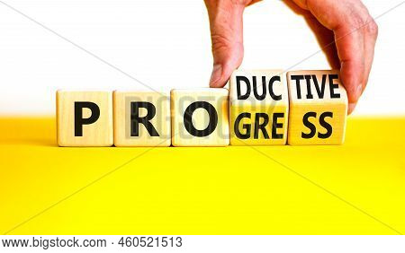 Word Progress And Productive Symbol. Businessman Turns Cubes And Changes The Concept Word Productive