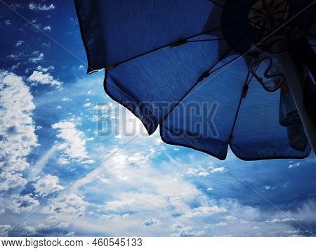 Umbrellas On The Beach In Late Summer On The Western Ligurian Riviera