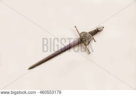 Antique Steel Dagger For The Left Hand With A Beautiful Handle Isolated On A White Background, Weste