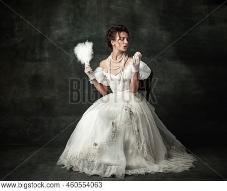 Temptation. Young Adorable Girl In Image Of Medieval Royal Person Or Viscountess Tasting Sweets Isol