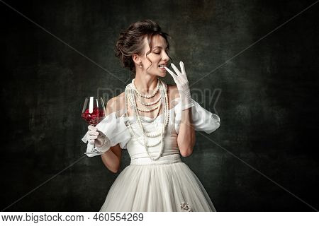 Young Charming Girl In Image Of Medieval Renaissance Person Or Viscountess Tasting Wine Isolated On 
