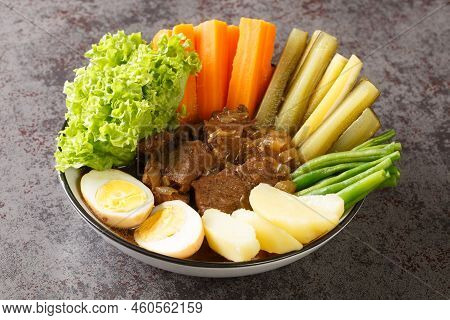 Selat Solo Javanese Dish Of Braised Beef Steak In Sweet Soy Sauce With Eggs, Potatoes And Vegetables