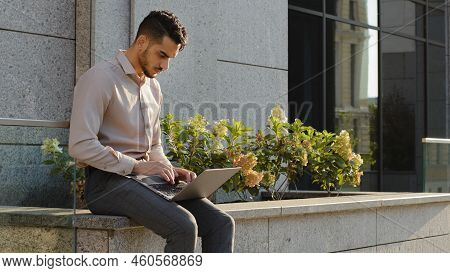 Young Formal Business Man User Manager Worker Student Sitting On Terrace Near Office Of Company Buil
