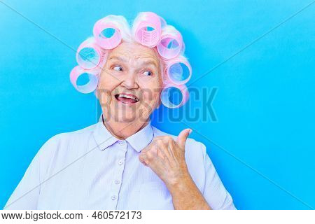 Charming Old Woman With Curlers On White Grey Hair Wear Shirt Getting Ready For Date Isolated On Bri