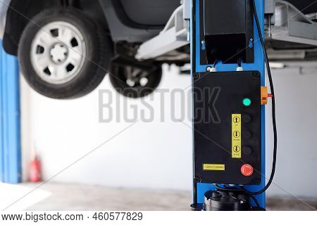 Car Service. Lifted Auto In The Garage. Diagnostics, Warranty Tecnical Maintenance, Repair. Car Insu