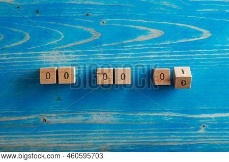 Six Wooden Blocks With 0 Written On Them And The Last One Turning To Number 1 In A Conceptual Image 