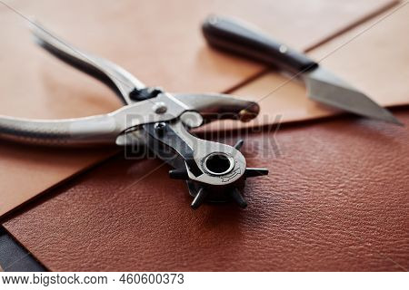 Close Up Of Leatherworking Tools On Piece Of Genuine Leather, Copy Space