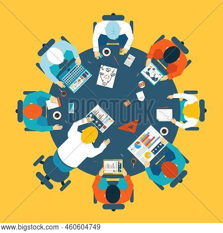 Brainstorming And Teamwork Concept With A Broup Of Busdinessman Having A Meeting Around A Round Tabl