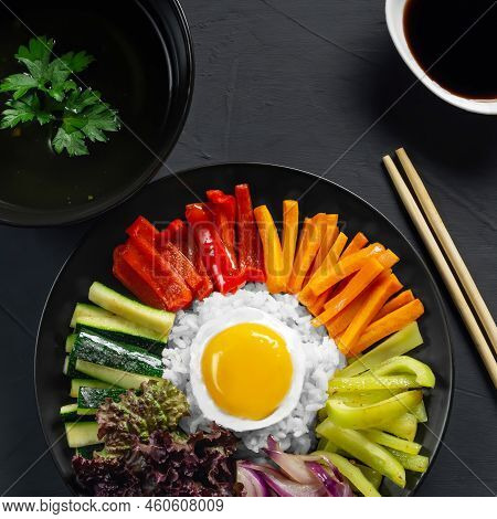 Close-up Of A Korean Dish, With A Variety Of Appetizers With Vegetables And Eggs. Diet. Bibimbap. To