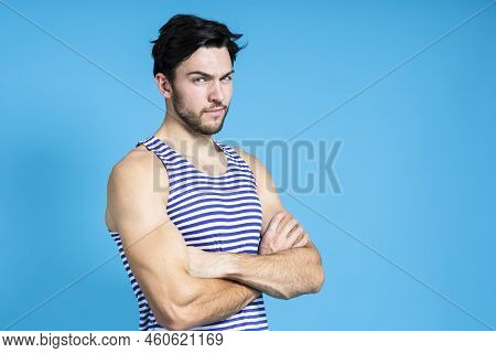 Serious Handsome Brunet Man In Striped Underware During Early Morning Posing With Hands Folded In Fr