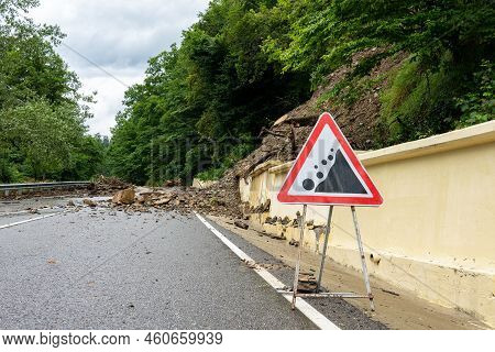 Rockfall On The Road. Rockfall Sign. Automobile Sign Of Falling Stones. Watch Out For Rockfall. Rock