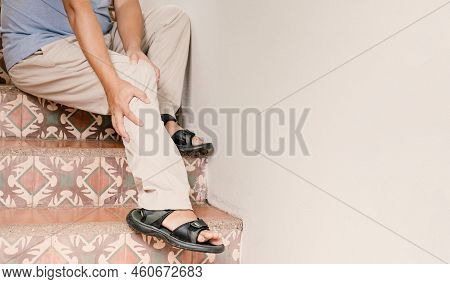 Man Hand Massage Physiotherapy Leg Is Sore And Numb, Exhausted, Tingling. Guillain-barre Syndrome, A
