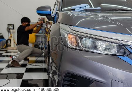 Car Detailing - Male Mechanic Holding Car Polishing Machine. Auto Industry, Car Polishing And Painti