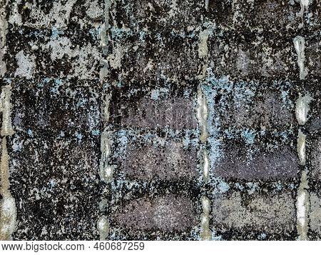 Dirty Old Eroded Cracked Plaster Cement Block Fence. Concrete Block Wall. Destroyed Crumbling Cement