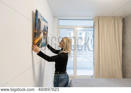 Photo Canvas Print. A Woman Holding A Photography With Gallery Wrap. Photo Printed On Glossy Synthet