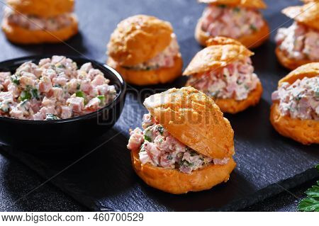 Ham Salad Serving It Sandwiched Between Airy Gougeres, Cheese Puffs On Black Stone Tray, Close-up