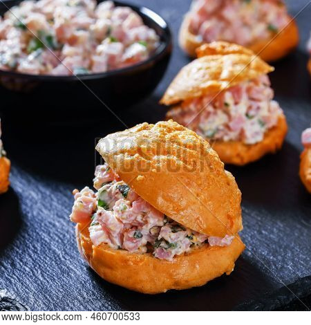 Close-up Of Ham Salad Serving It Sandwiched Between Airy Gougeres