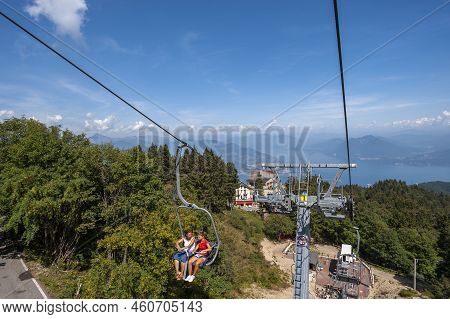 Stresa, Italy - August 17, 2018: Chairlift To The Top Of Monte Mottarone Near Stresa With Lake Maggi